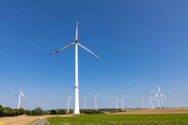 istock wind generator in rural landscape under blue sky 1059369070