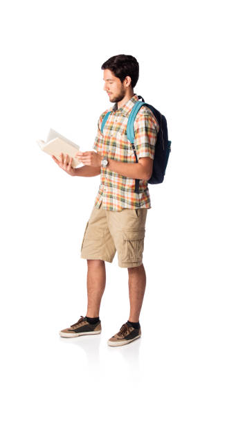 istock Male university student standing and reading book 1059369090