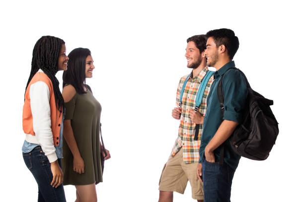 istock Four young students standing face to face and smiling 1059369096