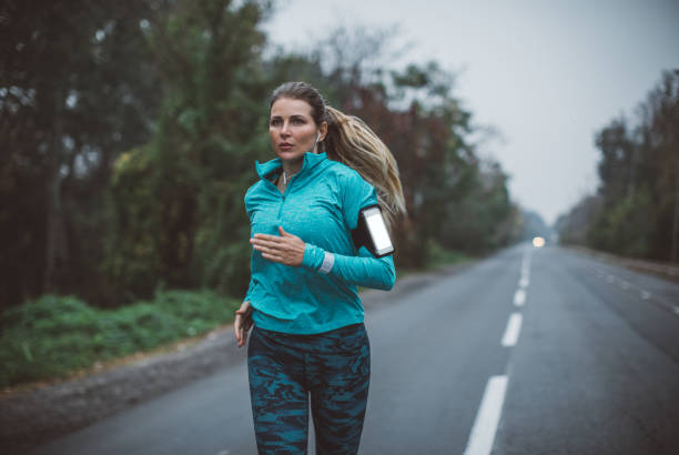 istock Woman running in park 1059369554