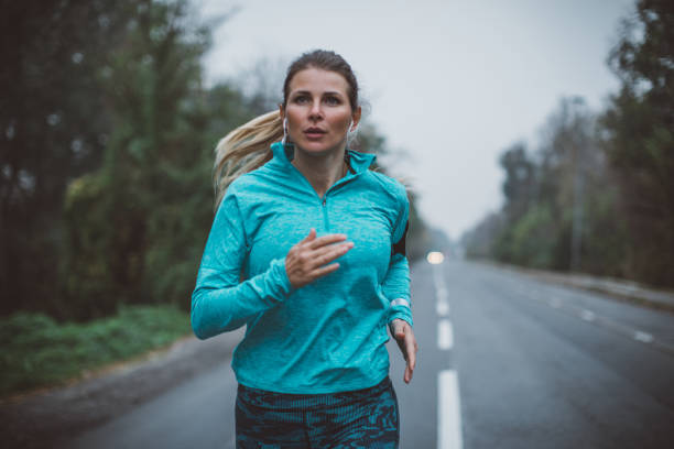 istock Woman running in park 1059369558