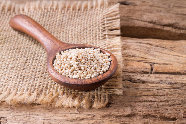 istock Quinoa seeds in bowl on rustic wood. 1059374596
