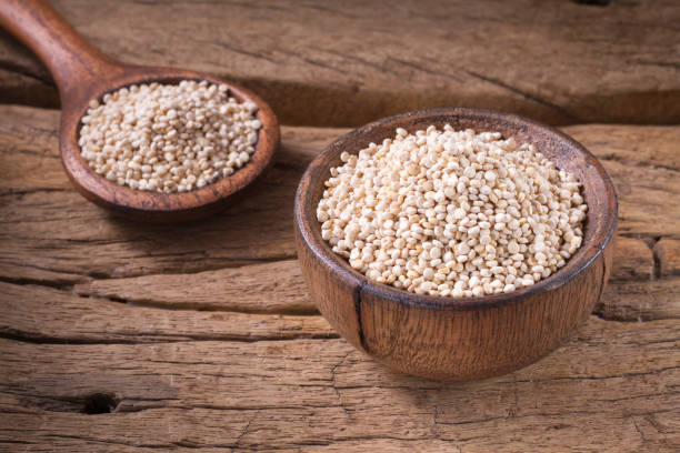 istock Quinoa seeds in bowl on rustic wood. 1059374838