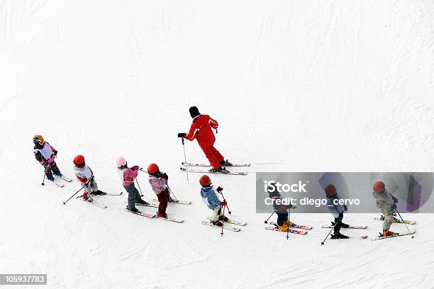 Aerial Shot Of A Group Of Young Skiers And Instructor Stock Photo - Download Image Now