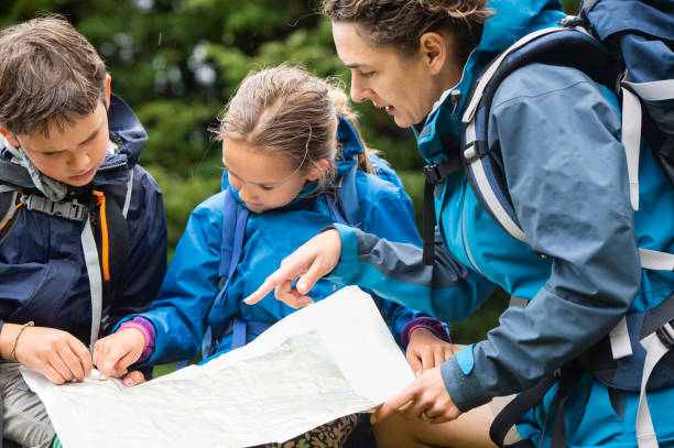 istock Family Map Reading in New Zealand Forest 1059380472