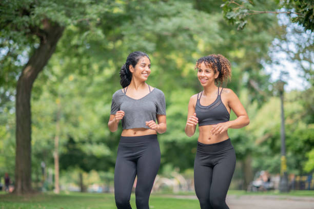 istock Young Women Jogging 1059384150