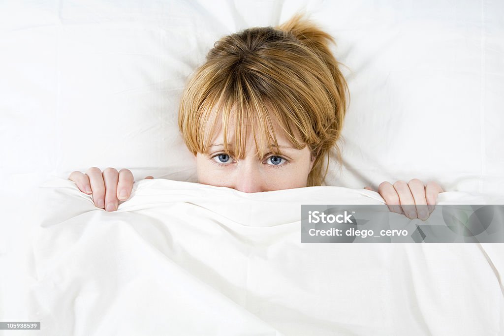 morning routine Young woman lying in bed doesn't want to wake up 20-24 Years Stock Photo