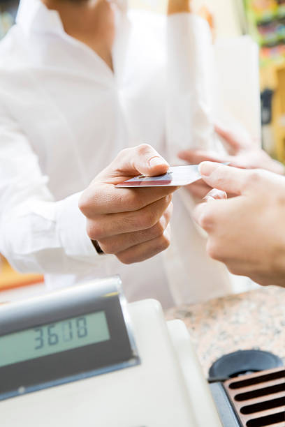 istock Customer using his credit card to make a payment 105938617