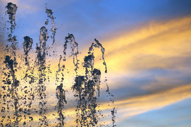 istock drops of the fountain in the setting sun 1059386350
