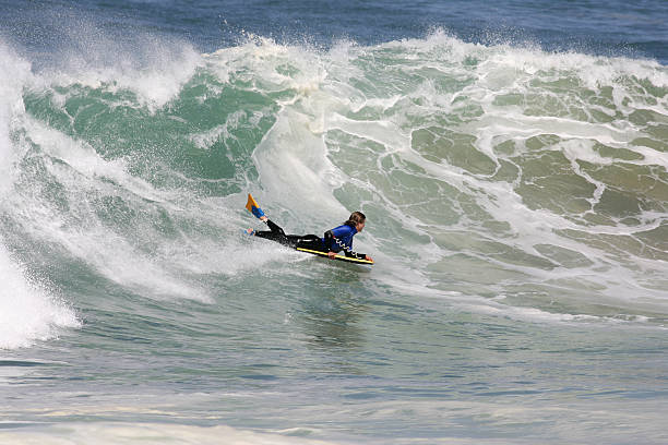 bodyboarder good bodyboarder in competition on a poverful wave in Anglet ( france) body board stock pictures, royalty-free photos & images