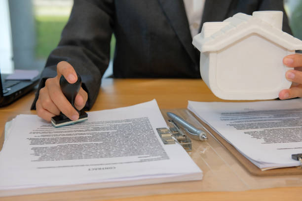 istock real estate agent stamping approved on mortgage loan contract agreement document 1059388136
