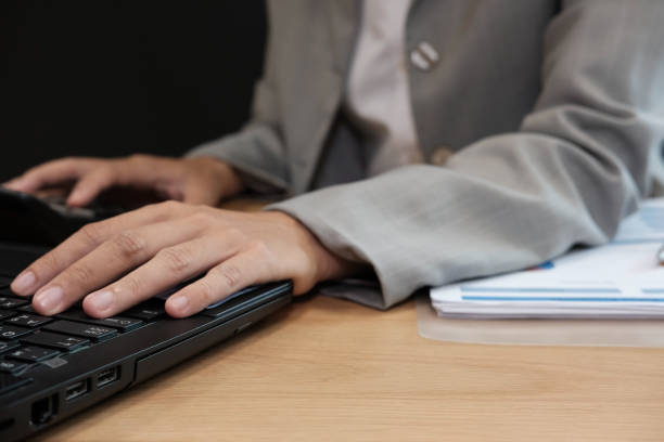 istock financial adviser working with calculator & computer. accountant doing accounting & calculating revenue & budget. finance & economy concept 1059388202