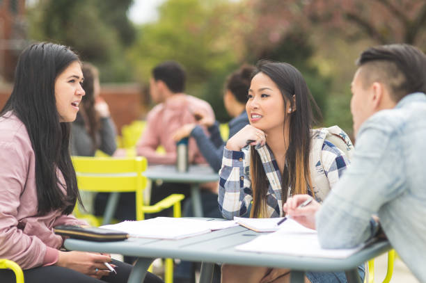istock College students studying at an outdoor table 1059392996