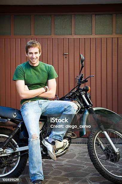 Motorbike Stock Photo - Download Image Now - Leaning, Motorcycle, Arms Crossed