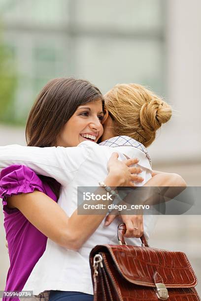 Colleagues Embracing Stock Photo - Download Image Now - 20-29 Years, 30-39 Years, Adult