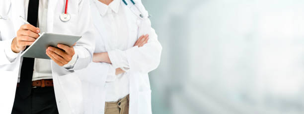 istock Doctor working in hospital with other doctors. 1059416782