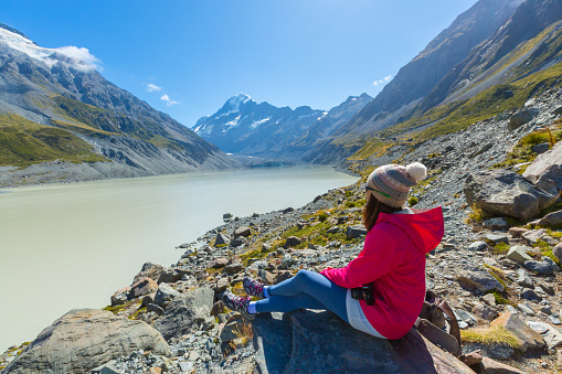 Asian woman travel enjoy at Mt. cook national park in New Zealand