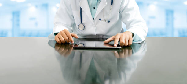 istock Doctor with tablet computer at hospital office. 1059419810
