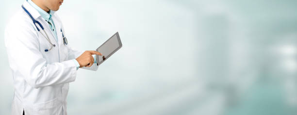 istock Doctor with tablet computer at hospital. 1059419866