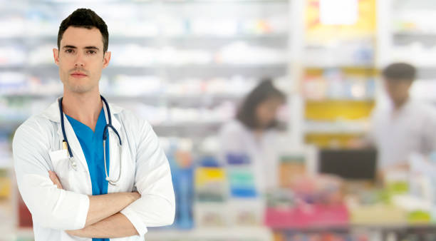 istock Male pharmacist working at the pharmacy. 1059420068