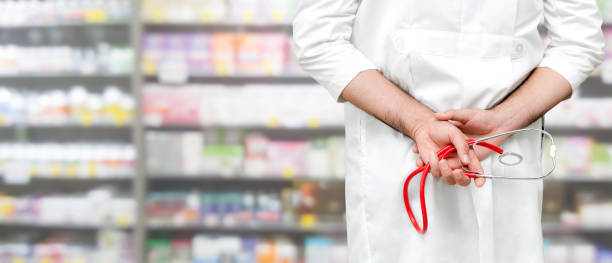 istock Male pharmacist working at the pharmacy. 1059420202