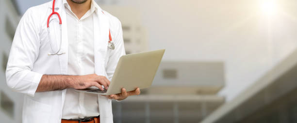 istock Doctor using laptop computer at the hospital. 1059420212