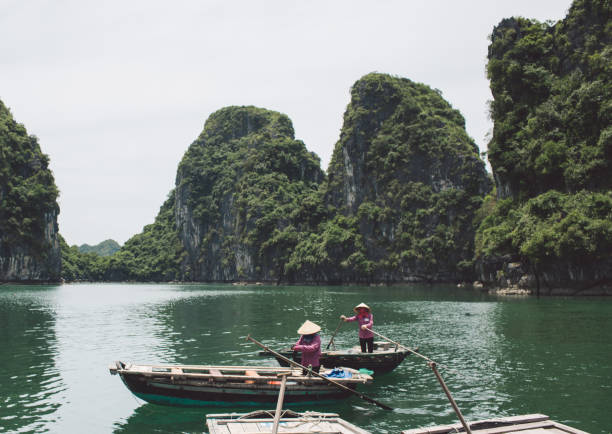 istock People In Boat On Lake Against Mountains 1059421952