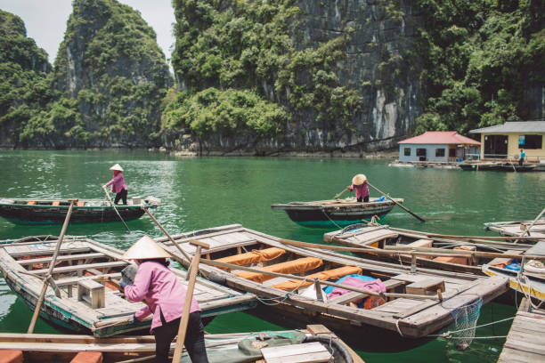 istock People In Boats On Lake Against Trees 1059421996