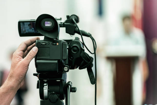 istock Cropped Hand Video Recording Speaker Standing On Stage 1059422774
