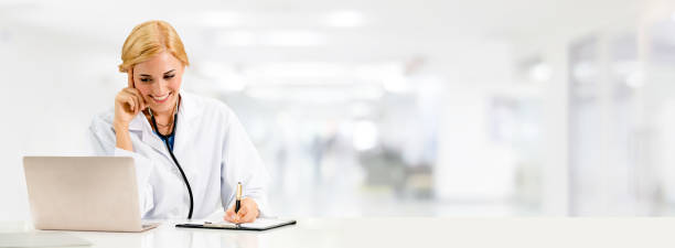 istock Doctor using laptop computer at the hospital. 1059422892