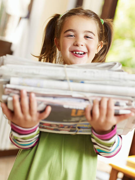 istock girl recycling newspapers 105942380