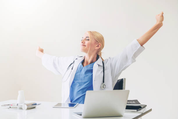 istock Relaxed doctor taking a break in hospital office. 1059425366