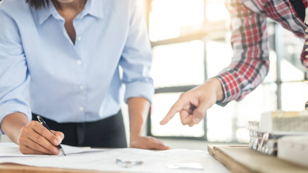 istock Architects Drawing Blueprint At Desk In Office 1059425506