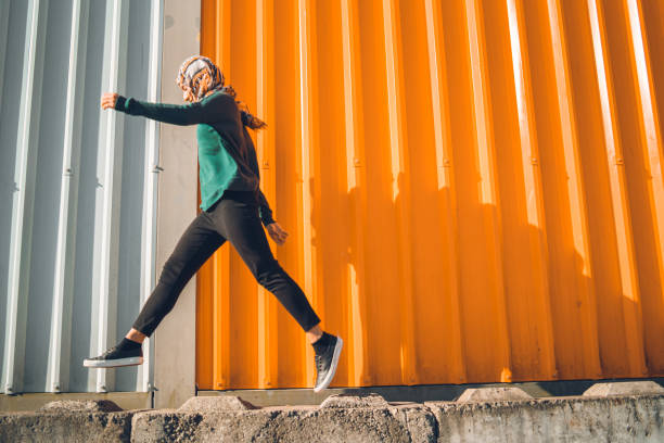 istock Muslim woman exercising. 1059425604