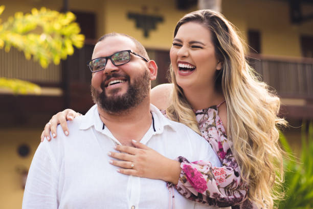 happy couple - portrait human face men overweight imagens e fotografias de stock
