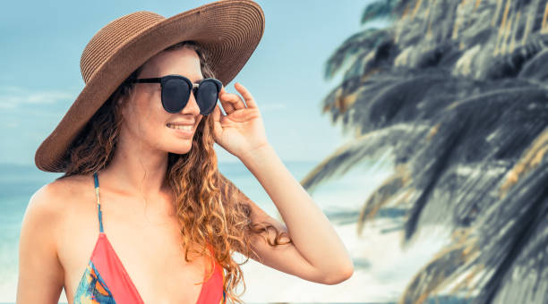 istock Happy young woman at beach in summer vacation. 1059426330