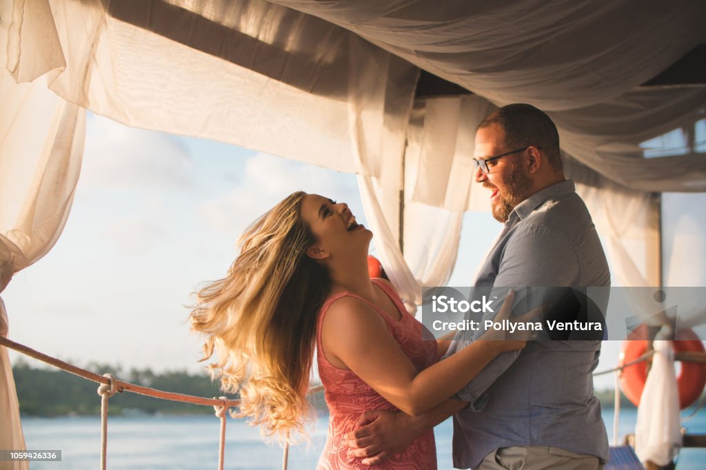 Couple dating on the pier Overweight, Pier, Couple - Relationship, Beach, Dating Overweight Stock Photo