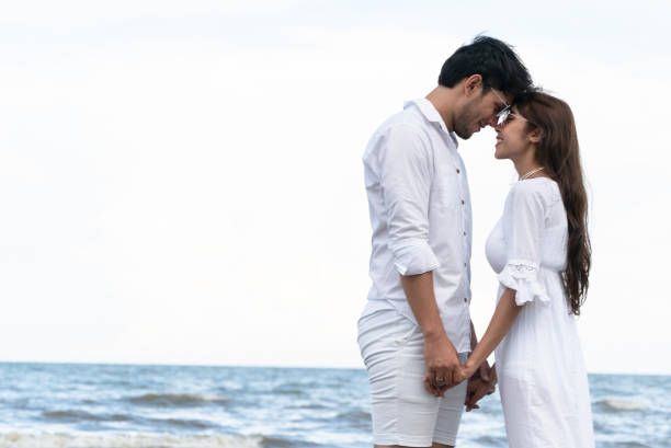 istock Couple going honeymoon on tropical beach in summer 1059426366