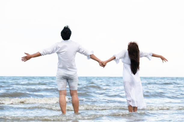 istock Couple going honeymoon on tropical beach in summer 1059426496