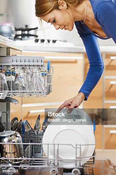 Woman Using Dishwasher Stock Photo - Download Image Now - Dishwasher, Women, One Woman Only