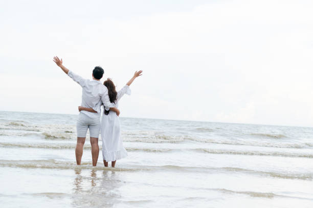 istock Couple going honeymoon on tropical beach in summer 1059427598