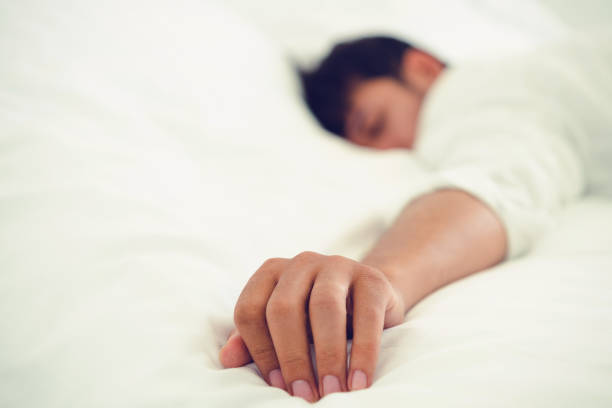 istock Young man sleep in bed in the bedroom. 1059428080