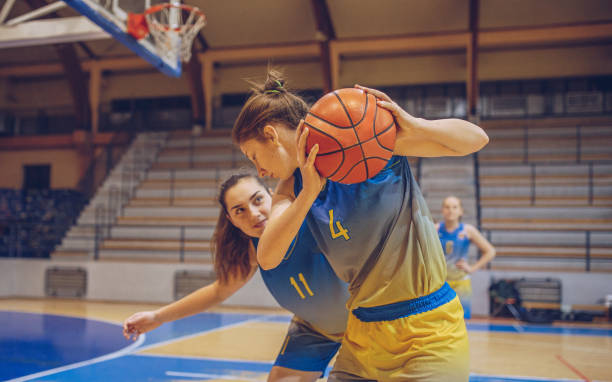 istock Girls basketball duel 1059440158