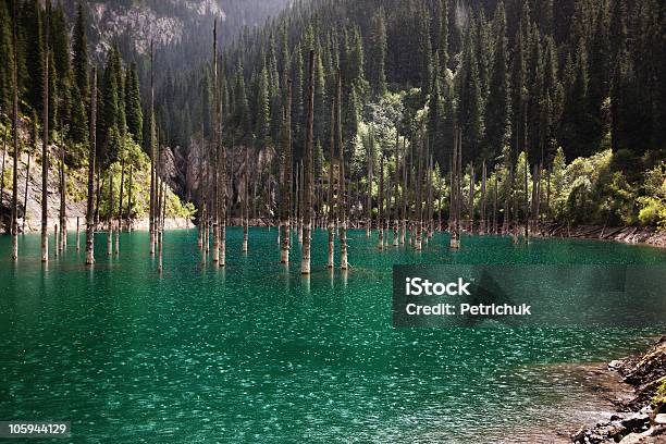 Rain In Sunlight On A Mountain Lake Stock Photo - Download Image Now - Kazakhstan, Lake, Beauty In Nature