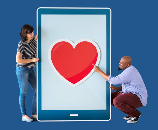 istock Diverse couple of people holding a tablet 1059446928