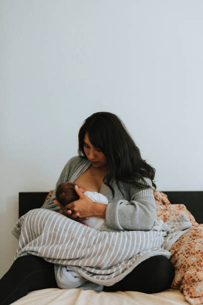 istock Mother breastfeeding her baby 1059452692