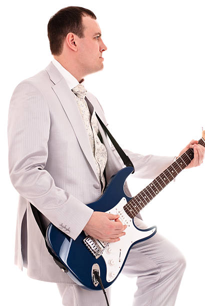 istock man in grey suit playing guitar 105945339