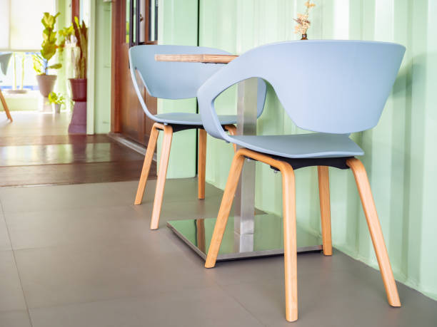istock Modern chairs and wooden table in cafe 1059454650