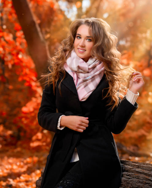 istock Girl in sunny autumn forest 1059468578