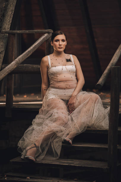 istock Pregnant woman sitting on steps 1059468754